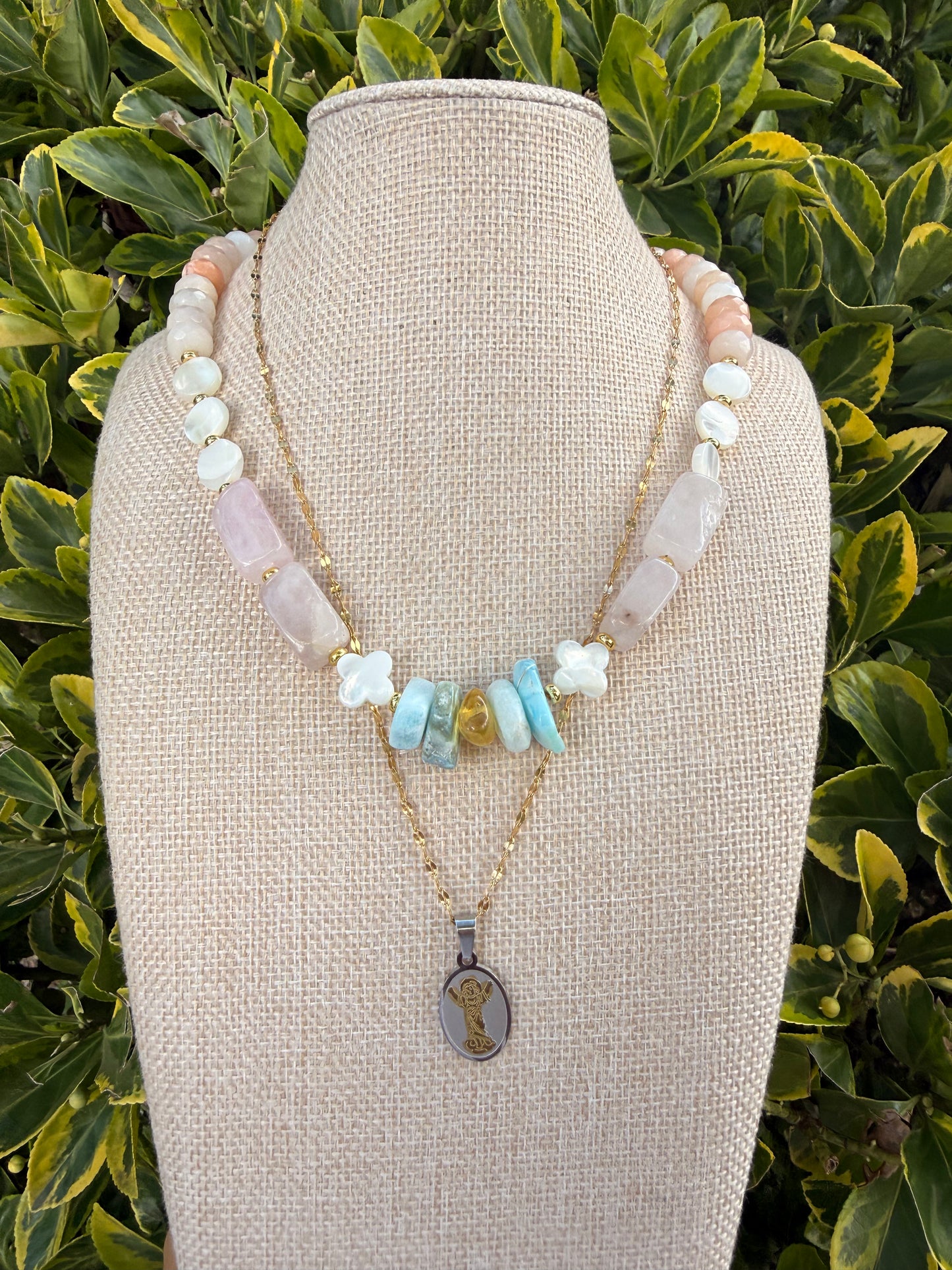 Asymmetrical multi stone set with Divino niño chain